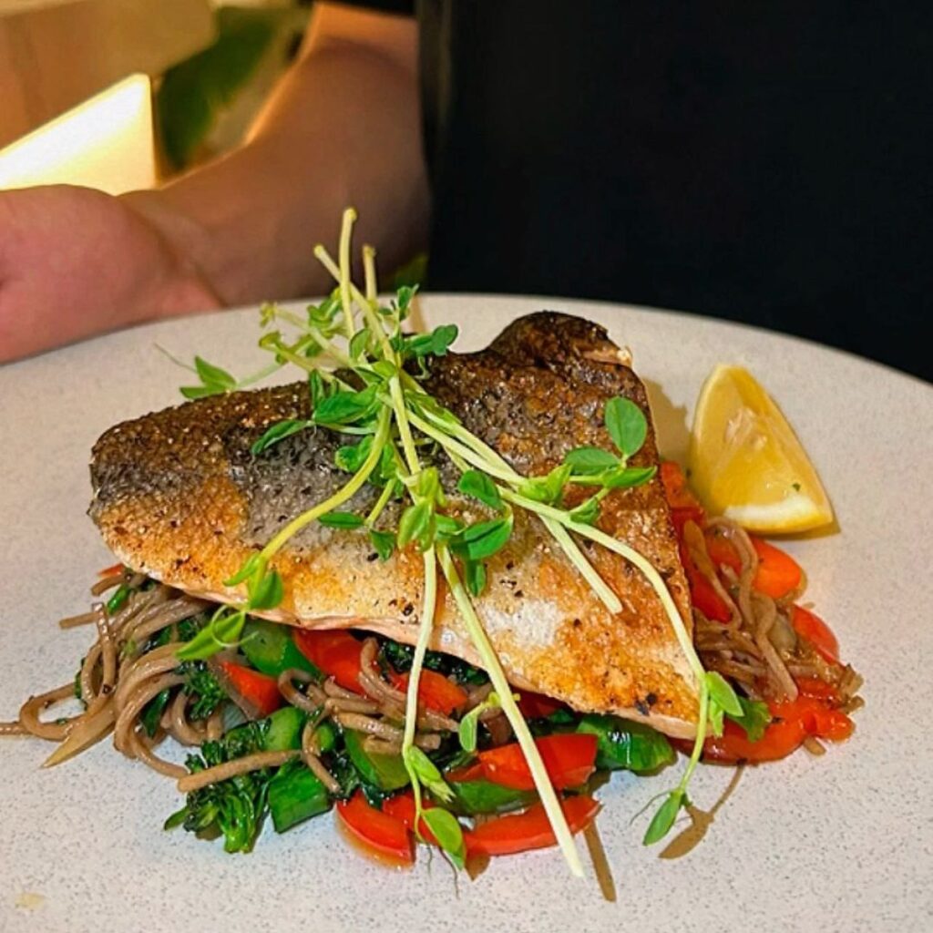 A plate of fish and vegetables, a healthy and colorful meal option - Restaurant 1903 Melbourne